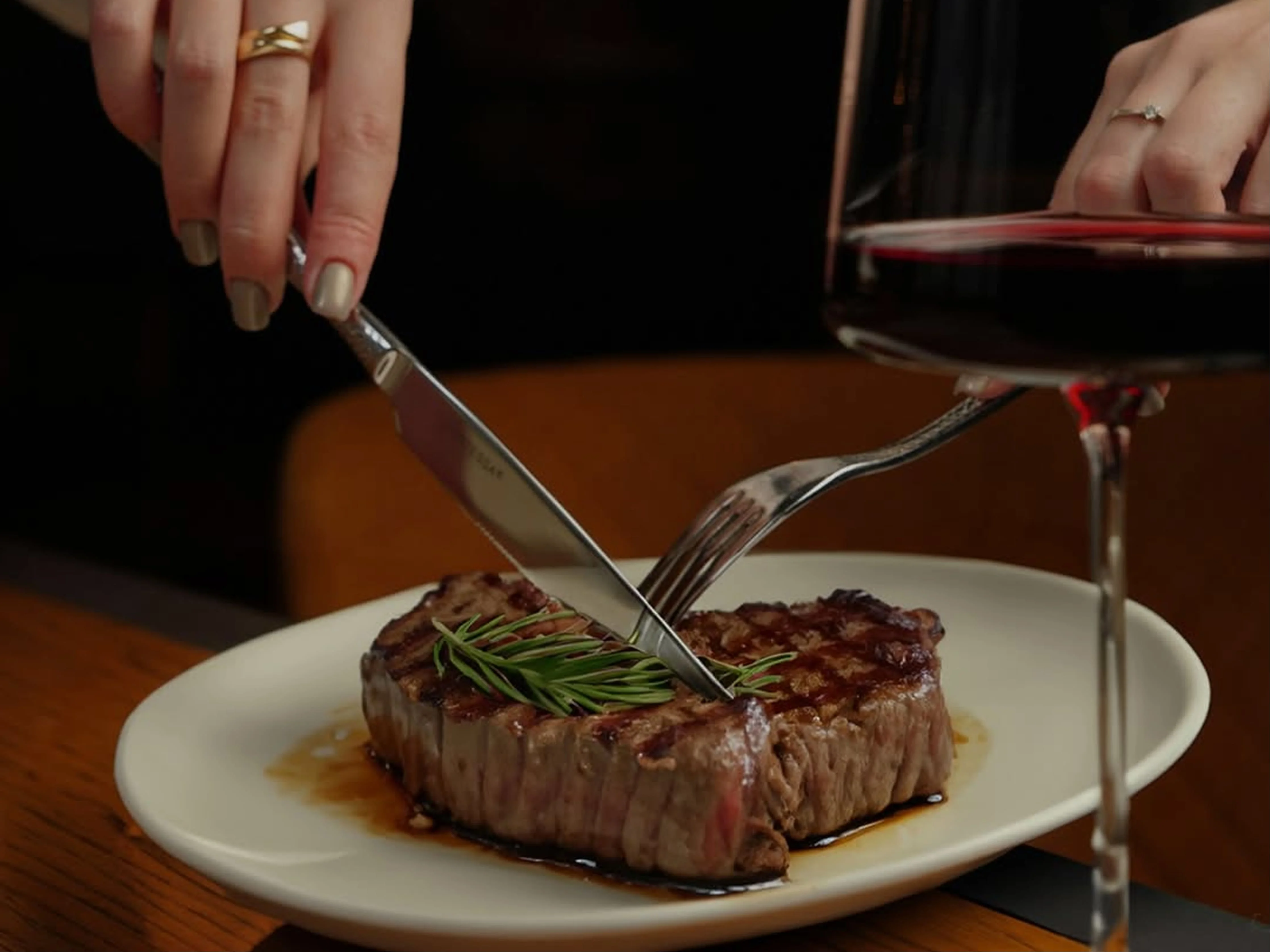 Filet mignon with red wine pairing, elegant candlelit dinner service at Hemdem Istanbul steakhouse