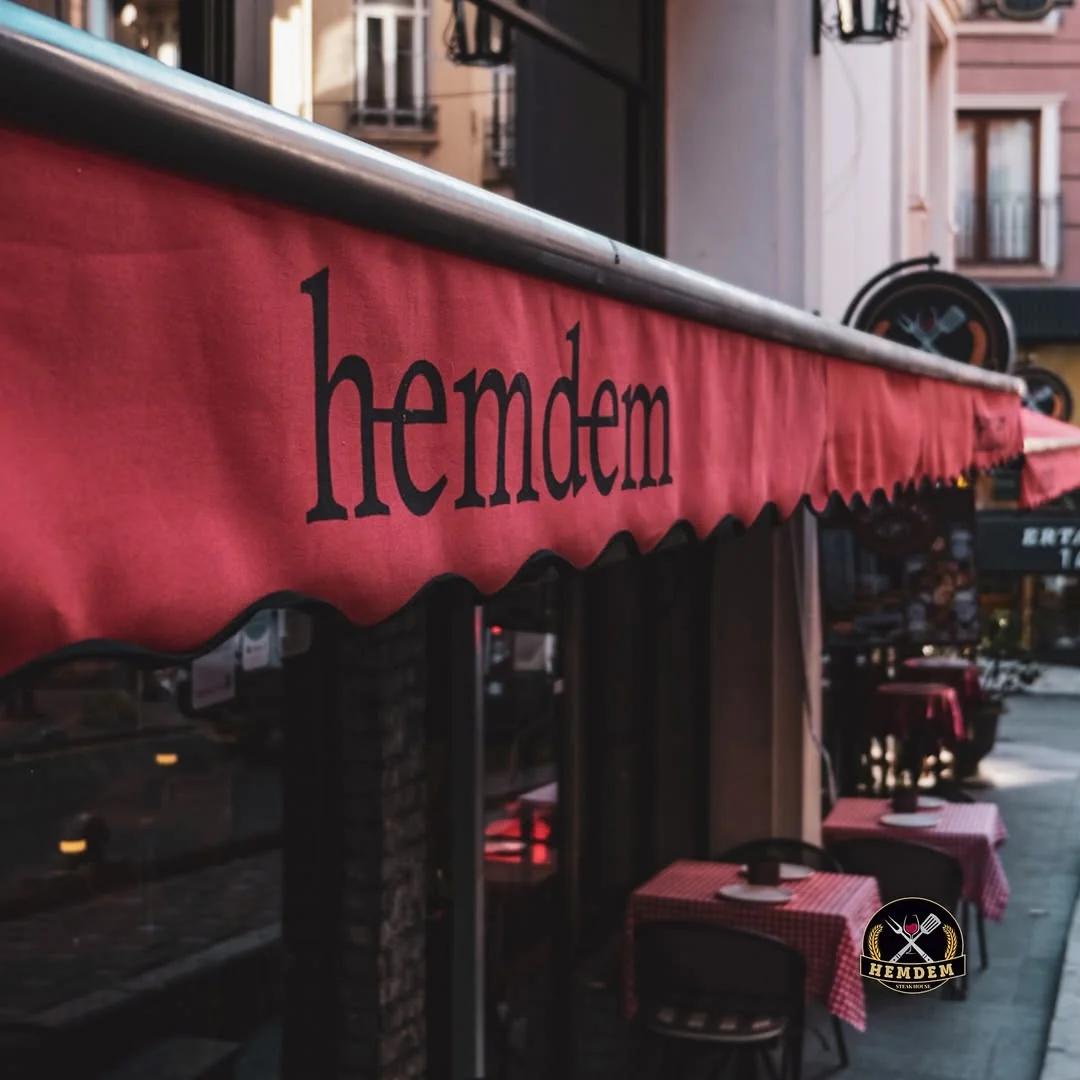 Hemdem Steak and Wine House exterior with red awning and outdoor terrace in Bomonti Istanbul